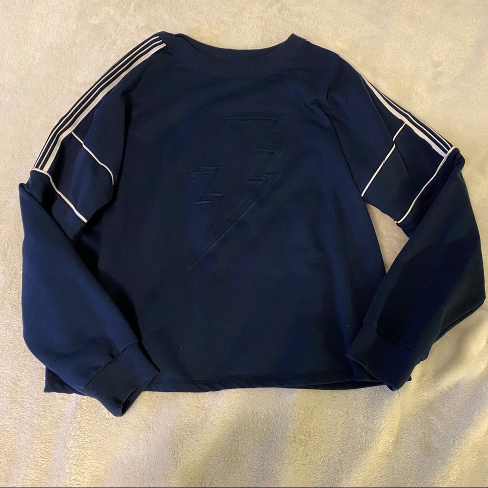 Dark blue top with white stripes on the sleeves